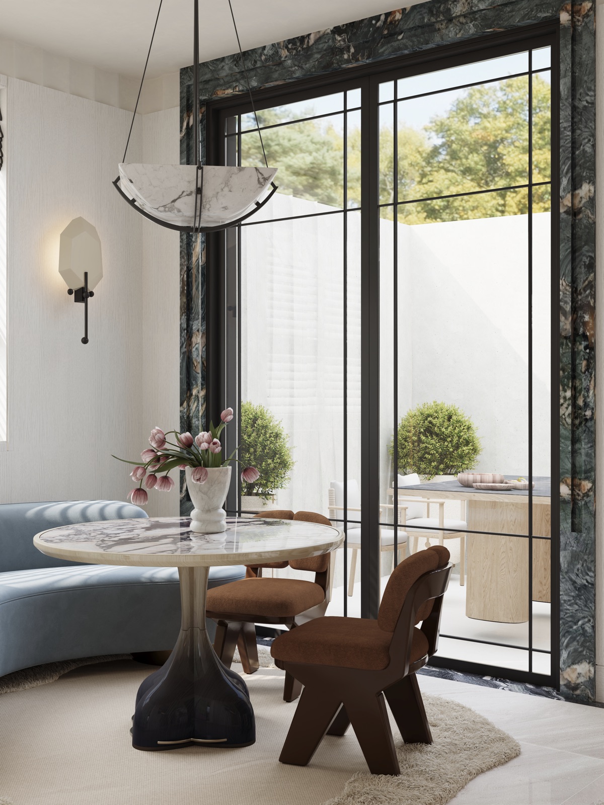 Breakfast area with curved cobalt-blue banquette and marble table