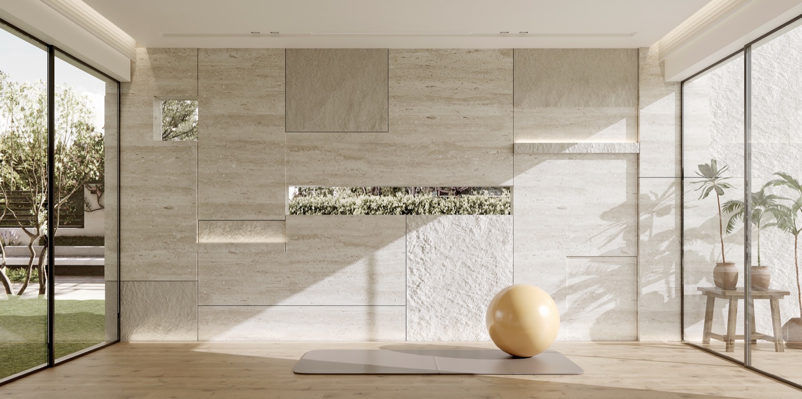 Gym with layered travertine wall and garden glazing